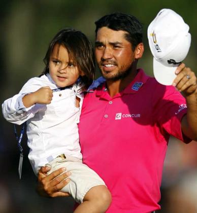 Australia’s Jason Day holds 4-year-old son Dash on the 18th green after wrapping up The Players Championship on the Stadium Course at TPC Sawgrass in Ponte Vedra Beach. Day, the world’s No. 1 ranked player, opened the tournament with a course record-tying 63 and never trailed en route to a wire-to-wire victory to finish at 15-under par (273 total). It was Day’s third victory of the 2016 season and seventh in the last 10 months. The 28-year-old claimed the winner’s check of $1.89 million while c