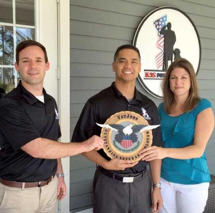 Rory Diamond, Jeff Beltran and Brianna Ehrhart of K9s for Warriors with the organization’s award for VetJobs Outstanding Veteran Employer. (photo submitted)