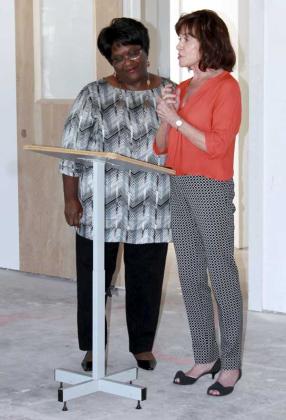Lilly Sullivan, president of the Rhoda Martin Cultural Heritage Center, and Debra Wotiz, Christ Church parishioner and project champion for Rising Tides, Inc., welcome project donors, staff and members of the community to the dedication event. (photo by Chelsea Wiggs)