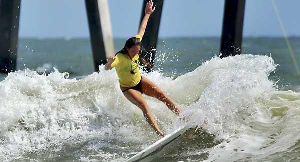 Piper Austin performs a cutback  during the Sisters of the Sea Surf Classic. (photo by Jim Walker)