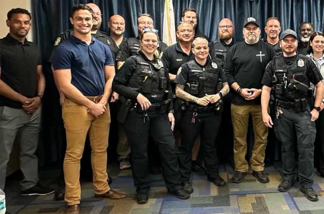 Members of the Atlantic Beach Police Department are shown with Officer Tim Stafford, fifth from right, who was recognized last week by the Atlantic Beach City Commission.