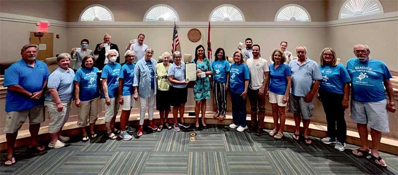 Beaches Sea Turtle Patrol volunteers receive the proclamation from Jacksonville Beach Mayor Chris Hoffman. (photo submitted)