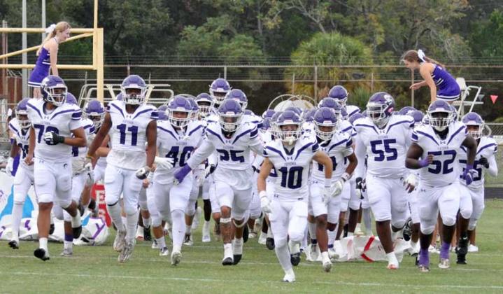 The Fletcher High School Senators take the field against Terry Parker. (photo by Jeanell Wilson)