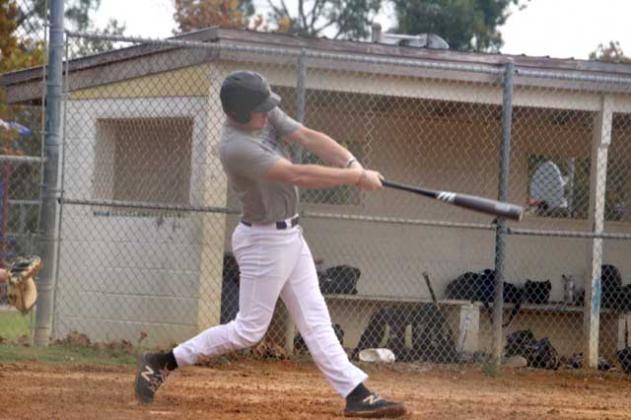Garrett Burton takes a swing during a double header against Paxon. (photo submitted)