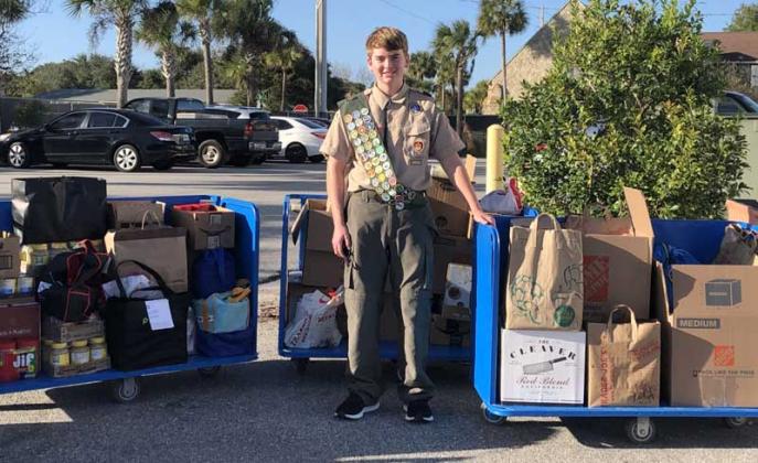 Ben Black stands with repaired carts and food donation. (photo submitted)