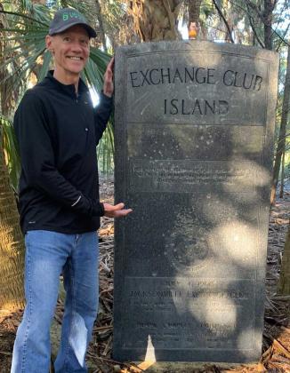 Beaches Exchange Club Past President Jim Hanson with the newly-cleaned Exchange Club Island monument. (photo submitted)