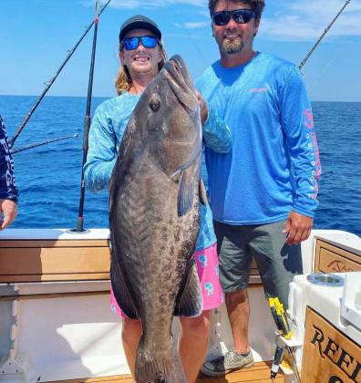 Cameron with a incredible birthday grouper caught on the Reel Dream out of St. Augustine last week. (photo submitted)