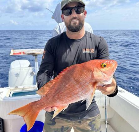 Congrats to local longboard legend Justin Quintal on winning his 11th Duct Tape Contest in Brazil and catching this big yellow eye snapper, a fish we don’t see very often in local waters. (photo submitted)