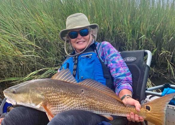 Lynne Gokey with her first bull redfish from a kayak. (photo submitted)