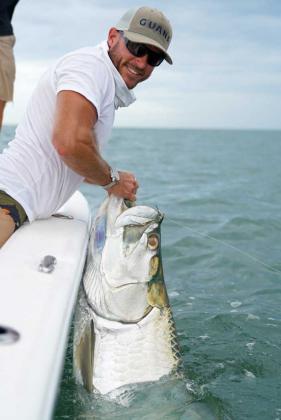 Capt. Matt Chipperfield with a nice tarpon caught off the beach just before the Isaias swell started to show. (photo submitted)