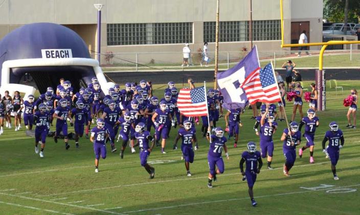 Fletcher football players run onto the field prior to the Gateway Conference game against Ribault. See more photos from the game in the e-Edition. (photo by Howard Muzik)