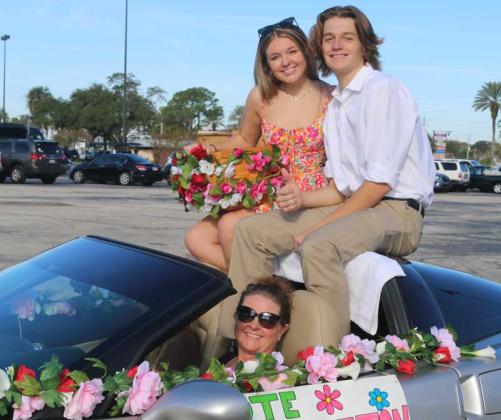 Abby and Mike represent the Fletcher High School Garden Club in the homecoming parade. (photo by Merle Watterson)