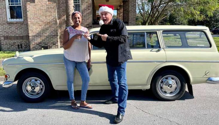 Tighist Paulos receives a car from The Two Titmice Foundation founder Ed Malin after winning a raffle benefiting the foundation. (photo submitted)
