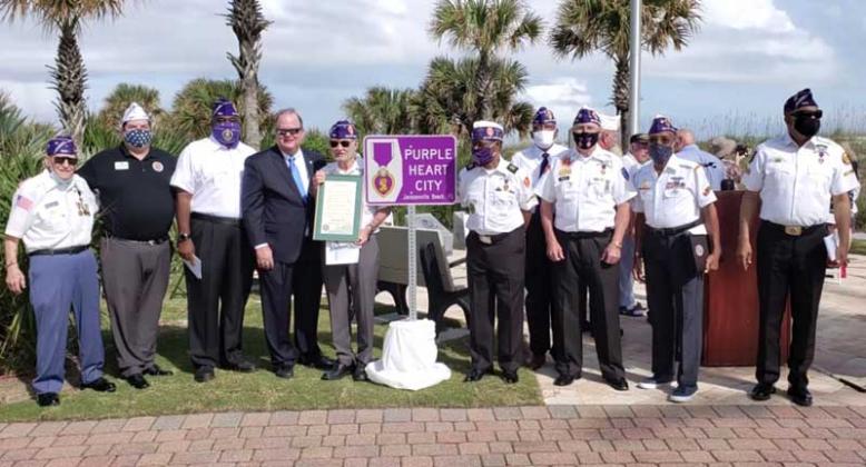 Jacksonville Beach Mayor Charlie Latham (fourth from left) and Purple Heart recipients attend a ceremony at the new Veterans Memorial in Oceanfront Park. (photo submitted)