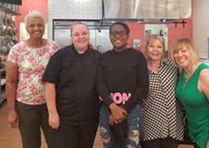 Symphony Brown (center) stands with judges of the Womens Food Alliance Kids Cupcake Contest. (photo submitted)