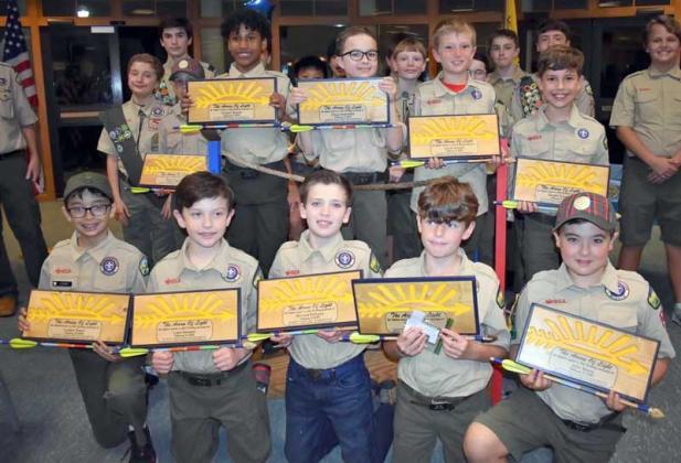 Arrow of Light Scouts holding their plaques are (first row) Ledger Kwon, Liam Stewart, Richard DePorre, Hunter Dykes, John Stone, (second row) Wylan Osgood, Chiston Skeete, Chase Hoenshel, Jacob Schoch and Xander Traveria. (photo submitted)