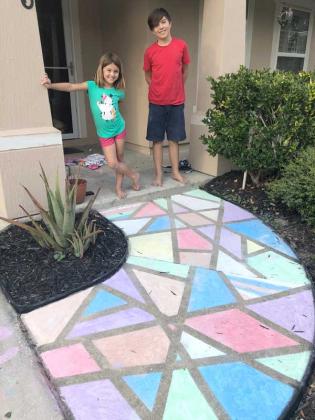 Beach students Tommy and Isabelle channel their creativity through chalk while staying home. (photo submitted)