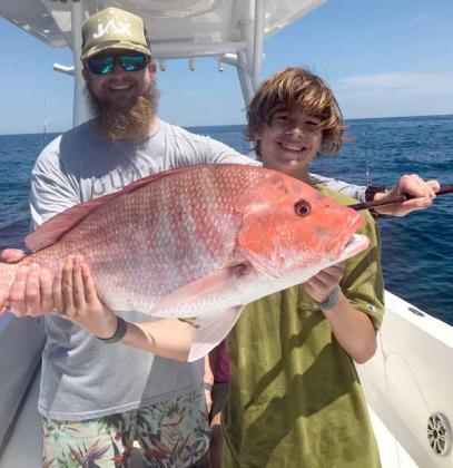 Chayton got to keep his first red snapper caught with Captain Chris Shultz.