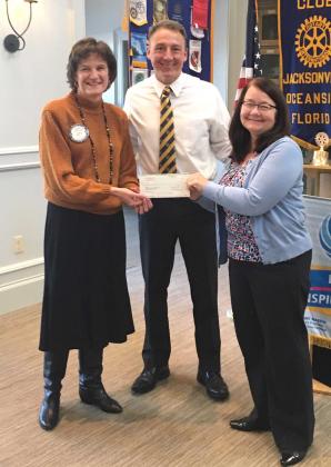 Shown are Community Service co-chair Cathy Hagan, President Michael Phillips and member and BEAM Executive Director Lori Richards. (photo submitted)