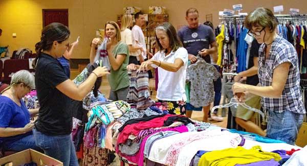 Volunteers sort clothing for BEAM's annual Back to School event. (photo by Katherine Stevens)