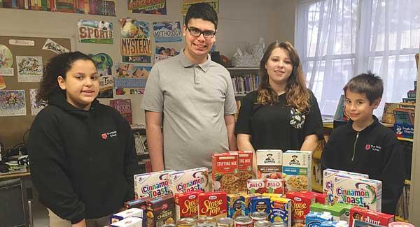 Students Katie Barajas, Diego Torres, Kylie Whitaker and Andrew Henner participated in the food drive for the USO.
