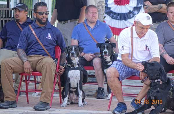 K9 Chief sits with Army veteran Tony Warren, center. (photo submitted)