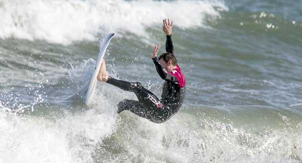 Surfer Corey Sapp snaps one off the lip just south of the Jacksonville Beach Pier. (photo by David Rosenblum)