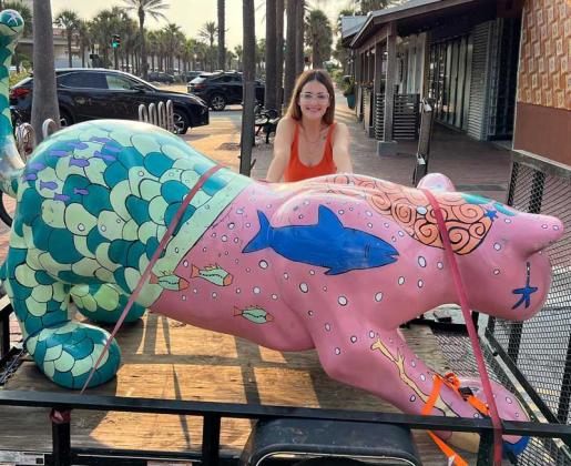Luisa Rodríguez and the Beaches Town Center's mermaid jaguar.