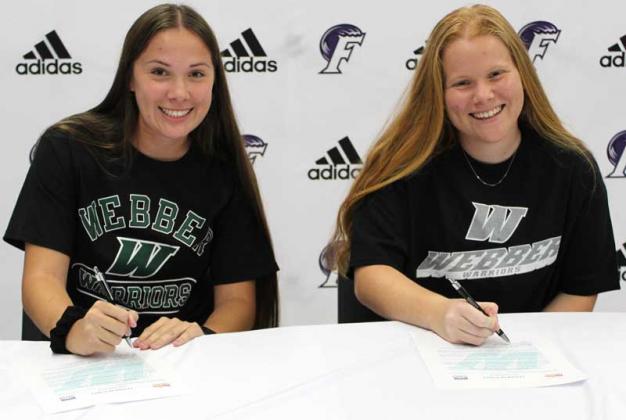 Sophia and Juliana Hilliard sign their commitments to Webber International University. (photo submitted)
