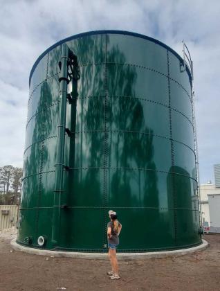 Rene Angers stands in front of new water tower in Neptune Beach neighborhood. (photo courtesy of Rene Angers)