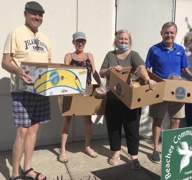 Monday’s delivery team, (from left) Don Lynn, Vicki Fitzgerald, Terry Greaves and Dewayne Truitt, heads out from Beaches Community Kitchen to take food to Beaches homebound residents. (photo by Linda Borgstede)