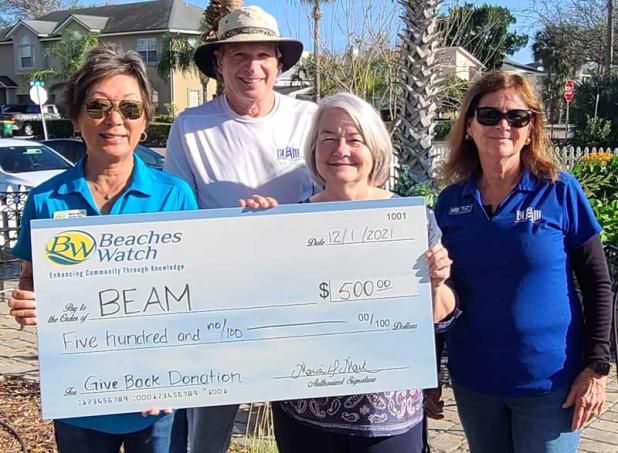 (From left) Beaches Watch President Maria Mark, BEAM volunteer Dr. Randy Hayes, BEAM Executive Director Lori Richards and BEAM Director of Food Services Mary Ellen Waugh are shown during the presentation of the 2021 Beaches Watch Give Back Donation to BEAM. BEAM (Beaches Emergency Assistance Ministry) received the award for helping local families recovering from the pandemic.