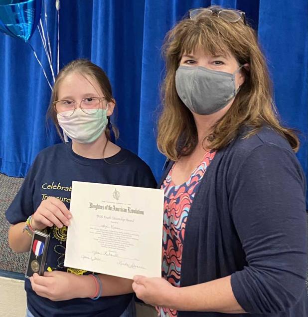 The Youth Good Citizen Award certificate and award are presented by Leslie May of the Jean Ribault Chapter of the Daughters of the American Revolution to Sage Kruse. (photo submitted)
