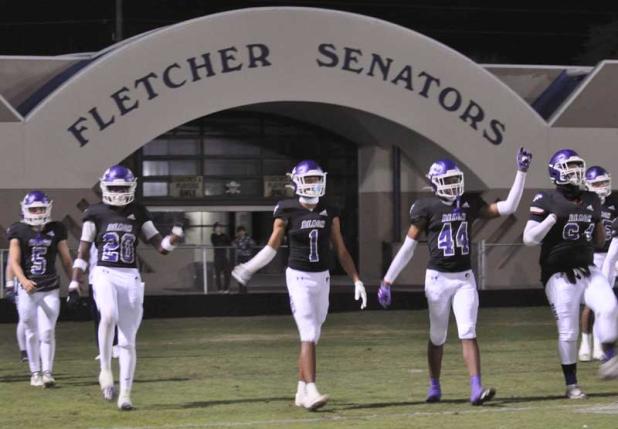 The Fletcher High School Senators take the field.
