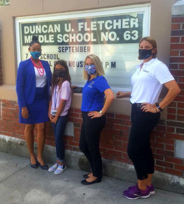 From left, Fletcher Middle School Principal Chelsea Mathews, sixth grade student Mikaela Broci, Vice Principal Sarah Wiggins and sixth grade teacher Jennifer Auvil, who also heads the new AVID program. (photo by Liza Mitchell)