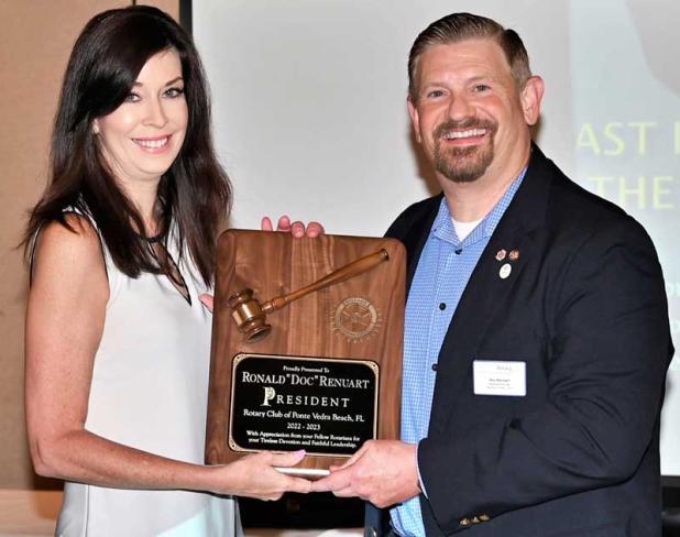 Jennifer Logue presents outgoing President Doc Renuart with his President's Plaque.