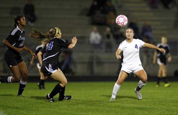 Fletcher High’s Danielle Van Liere (4) looks to head the ball near midfield during last Friday’s Gateway Conference girls soccer championship game against Stanton Prep at Jack Taylor Stadium. (photo from Rob DeAngelo)