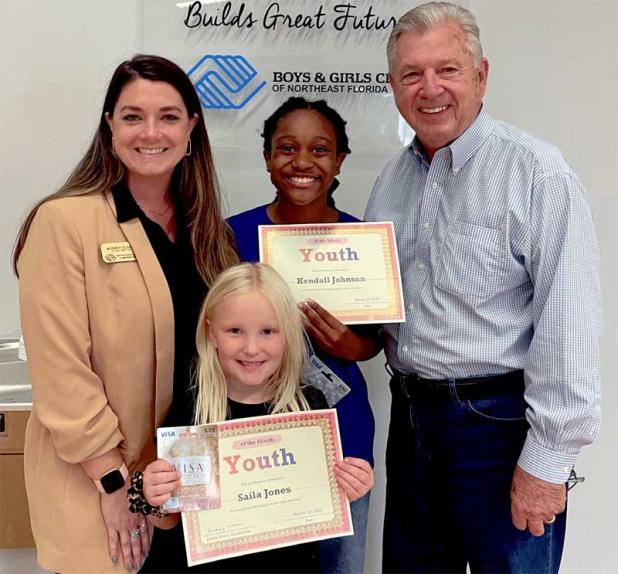Shown are, from left, Unit Director Audrey Clowe, Kendall Johnson, Saila Jones and Scott Wiley, program sponsor. (photo submitted)