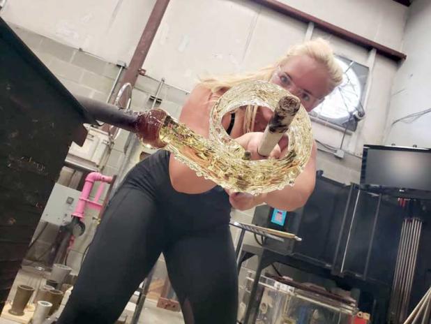 Megan Reid focuses on her glass blowing. (photo submitted)