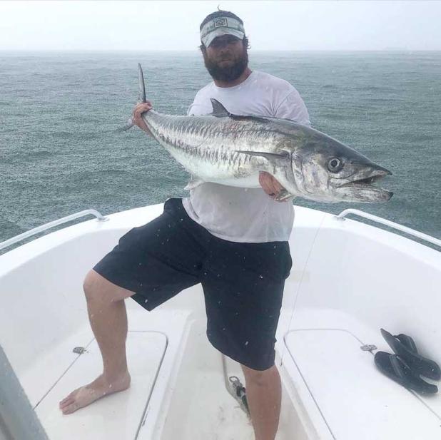 Tyler Smith with a huge 50-pound early season beach king. (photo submitted)