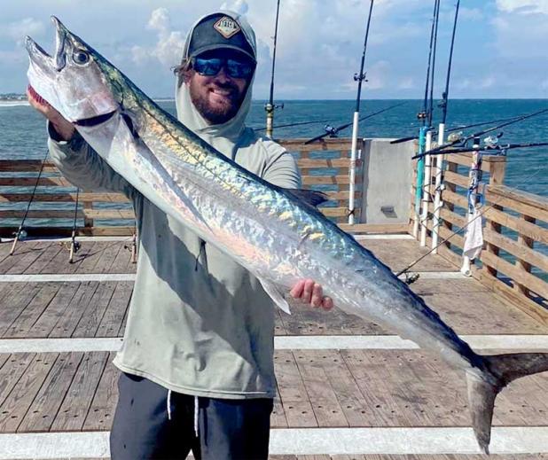 Capt. Joe Curtis with Set Em Up Fishing Charters caught a nice kingfish off the pier this week. (photo submitted)