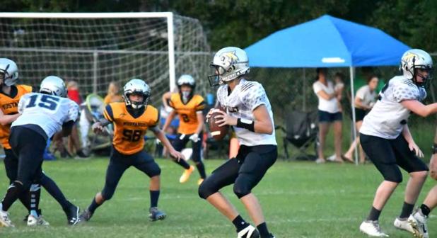 Cooper Froehlich, quarterback for Palm Valley Academy, prepares to pass the ball against Mill Creek Academy. (photo by Kendra Hardie)