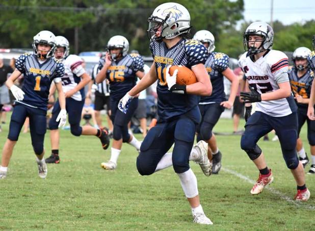 Landon Okla runs with the ball. Okla rushed 11 times for 255 yards and two touchdowns. (photo by Kendra Hardie)