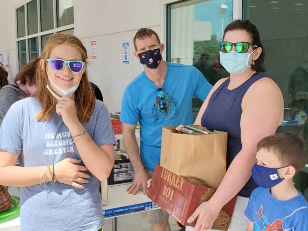 Book fans pack up their selections at a recent Beaches Branch Library pop-up book sale. (photo courtesy of Friends of the Beaches Branch Library)