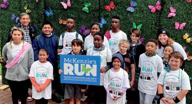 Boys & Girls Clubs of Northeast Florida President and CEO Paul Martinez poses with club members from McKenzie’s Beaches Boys & Girls Club after they completed the 5K at the 13th Annual McKenzie’s Run. (photo submitted)