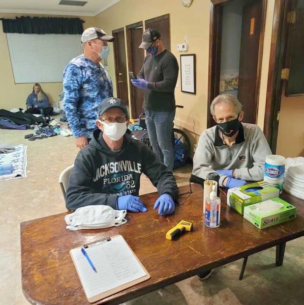 Volunteers check people in to the cold night shelter at Oceanside Christian Church Tuesday night. (photo provided by Tracy Gebeaux)