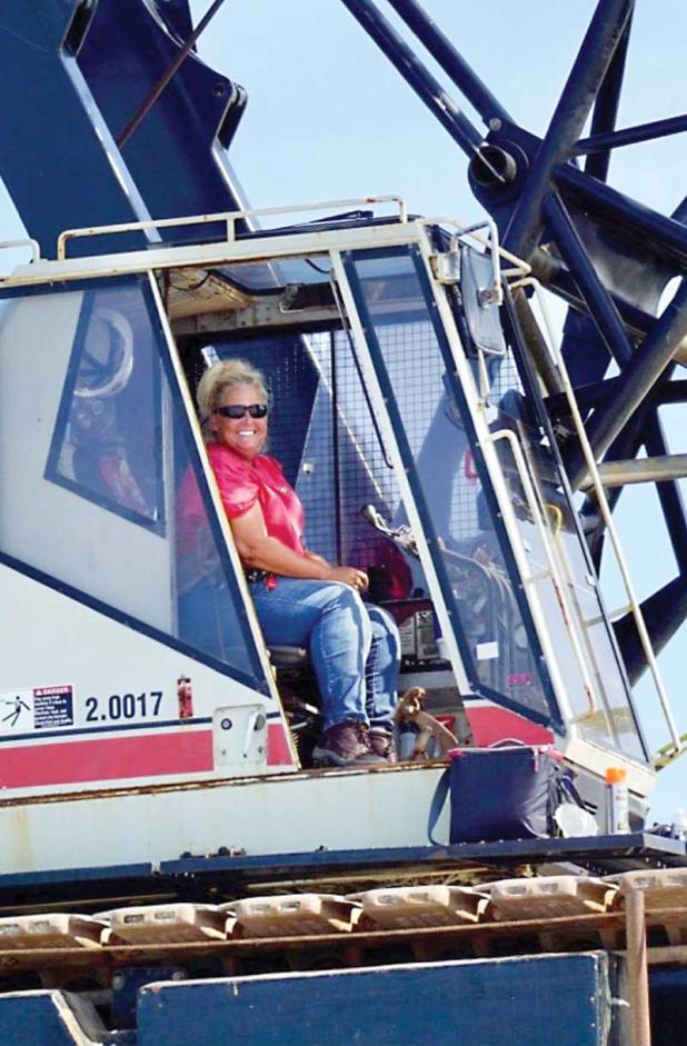 Crane operator Sandy Vann is part of the crew repairing the Jacksonville Beach Fishing Pier. She has worked in the industrial field for more than 20 years. (photo by 911 Surf Report)