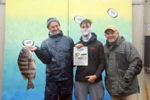 Sehaid Dedic, left, with the 11.76-pound winning sheepshead. (photo submitted)
