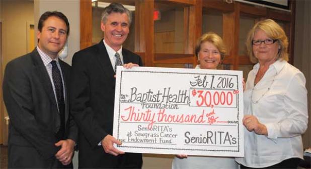 (From left) Jason Simpson, development director at Baptist Beaches; Joe Mitrick, hospital president; Carol Carter; and Donna Wagener.