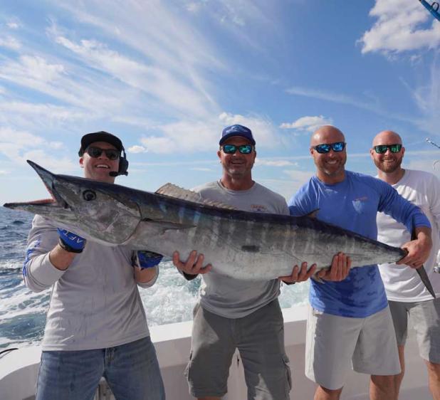 An 85-pound wahoo caught by Blue Waters Sportfishing. Shown are, from left, Freddy Wanio, Wes Baker Matt Baker and Andy Baker. (photo submitted)